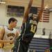 Huron's Marcus Buggs reaches for a rebound. Angela J. Cesere | AnnArbor.com
