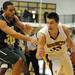 Huron's Mike Lewis, left, tries to block Saline's K.C. Borseth from driving to the basket. Angela J. Cesere | AnnArbor.com
