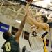 Huron's Antonio Henry, left, tries to block a shot by Saline's Michael Smutny. Angela J. Cesere | AnnArbor.com