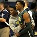 Huron's Kendall Thomas, left, celebrates Huron's 46 - 51 win against Saline with teammate Andre Bond. Angela J. Cesere | AnnArbor.com