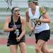 Pioneer's Mercedes Reyes, left, tries to block Huron's Taylor Standiford from moving down the field during the lacrosse quarter finals game at South Lyon High School. Angela J. Cesere | AnnArbor.com