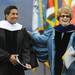 CNN Chief Medical Correspondent and neurosurgeon Sanjay Gupta laughs with University of Michigan President Mary Sue Coleman after giving the commencement address for the U-M graduating class of 2012 at Michigan Stadium. Angela J. Cesere | AnnArbor.com