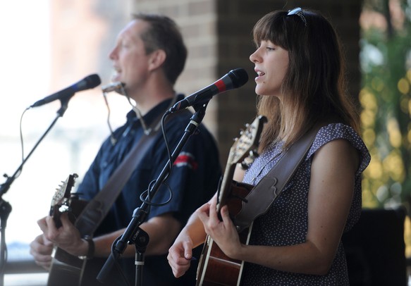 Rochelle Clark, right, and John Natiw, perform as the band The Potter's Field during the AnnArbor.com summer concert series on Liberty and Fifth Ave. in Ann Arbor. Angela J. Cesere | AnnArbor.com 