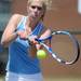 Skyline's Megan Smith swings at the ball in the 2 singles match against Pioneer's Azba Gurm at a tournament at Pioneer High School on Wednesday afternoon. Angela J. Cesere | AnnArbor.com