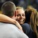 Michigan guard Courtney Boylan, center, hugs her mom Molly Boylan, right, and Cory Zurowski after Michigan won 73-62 over Ohio State. Angela J. Cesere | AnnArbor.com