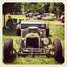 An owner sits by his car during the Billettproof Vintage Hot Rod Show show at Ypsilanti's Riverside Park. (jglo)