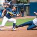 Wolverines senior Ashley Lane safely slides in to third base during the second inning of their game against California, Saturday May 18.
Courtney Sacco I AnnArbor.com     