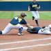 Wolverines first basemen junior Caitlin Blanchard tags out California's Breana Kostreba at first during the second inning of the NCAA regional title game, Sunday May 19.
Courtney Sacco I AnnArbor.com 
