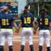 The University of Michigan softball team holds hands during the National Anthem at the start of the NCAA regional title game against California, Sunday May 19.
Courtney Sacco I AnnArbor.com 
