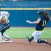Wolverines junior Lyndsay Doyle slides in to second base but is tagged out by California's Victoria Jones during the fifth inning of the NCAA regional title game, Sunday May 19.
Courtney Sacco I AnnArbor.com 
