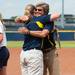 Wolverines head coach Carol Hutchins hugs another coach after winning the NCAA regional title game against California, Sunday May 19.
Courtney Sacco I AnnArbor.com  