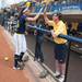 Wolverines Nicole Sappingfield high fives University of Michigan Athletic Director Dave Brandon after winning the NCAA regional title game against California, Sunday May 19.
Courtney Sacco I AnnArbor.com  