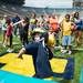 Four year old Max of Ann Arbor  throws the ball as he plays a blow up QB Blitz game during youth day at Michigan Stadium, Sunday, August, 11.
Courtney Sacco I AnnArbor.com 