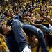 Michigan sophomore Simon Rivers lifts his friend Brenae Smith after a Michigan basket during a watch party at Crisler Arena on Monday, April 8. Daniel Brenner I AnnArbor.com