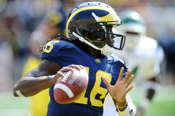 Michigan quarterback Denard Robinson curious about NFL standing, says he's  likely to return