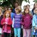 The Dicken Elementary Recess Singers sing "Lean on Me" during the memorial bench dedication in memory of Mariel Almendras on the Dicken Elementary School playground in Ann Arbor. Mariel attended Dicken as a student before she passed away last November, fighting childhood ovarian cancer. Angela J. Cesere | AnnArbor.com