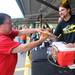 Dan Richmond of Wolverine State Brewery hands Ann Arbor resident John Hyde a cup of their premium lager at Nashbash. Angela J. Cesere | AnnArbor.com