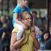 Ann Arbor resident Kristie Gardner holds her daughter, Ainsley, age 5, on her shoulders while they listen to the music of Kathy Hussey. Angela J. Cesere | AnnArbor.com