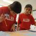 Allen Elementary School 4th graders Sophie Bottum-Musa, left, and Sophia Papadopoulos use maps to answer questions during the map reading portion of the Washtenaw Elementary Science Olympiad. Angela J. Cesere 