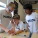 Emerson elementary school 4th graders Brenan Dionne, left, Casey Lewis, center, and Anvit Rao wire a circuit.  Angela J. Cesere 