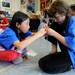 Haisley elementary 5th graders Christine Yan, left, and Courtney Smith build a tower with straws to support weight during the Washtenaw Elementary Science Olympiad. Angela J. Cesere 