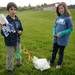 Pittsfield elementary 5th graders Mohamed Hamidi, left, and Sarah Gubachy retrieve their water rocket from it's landing spot during the Washtenaw Elementary Science Olympiad. Angela J. Cesere 