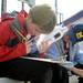 Honey Creek elementary 5th graders Justin Alexander, left, and Eric Mackie take a test about water rockets before they launch their own water rocket during the Washtenaw Elementary Science Olympiad. Angela J. Cesere  