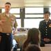 Former Ann Arbor resident and current Navy Petty Officer 1st Class, James Penney, left, and Marine Corps. Sgt. Bao Lee, right, answer questions about the military from Salvador Barrientes' 7th grade English class at Scarlett Middle School on Friday morning. Barrientes, who served in the Marines, arranged for Penney and Lee to visit the school and participate in Memorial Day assembly. Angela J. Cesere | AnnArbor.com