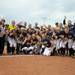 The Michigan softball team poses with the Big Ten conference championship trophy, which is the fifth consecutive Big Ten title they've won. Angela J. Cesere | AnnArbor.com