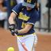 MIchigan sophomore Nicole Sappingfield hits the ball during the second game of a three game series against Purdue on Saturday. Angela J. Cesere | AnnArbor.com