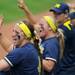 Michigan sophomore Taylor Hasselbach, left, and sophomore Brandi Virgil cheer from the dugout during the game against Purdue. Angela J. Cesere | AnnArbor.com