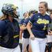 Michigan sophomore catcher Caitlin Blanchard, left, congratulates Michigan senior Hilary Payne after Payne pitched for the first time in Big Ten play, closing out the last inning of three series games against Purdue. Angela J. Cesere | AnnArbor.com