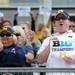 California resident Lori Brundage, left, and Ann Arbor resident Richard Boys cheer and hold up a Big Ten Champions sign after Michigan was presented with the Big Ten conference champion trophy on Saturday afternoon, after beating Purdue in all three games of a three game series. Angela J. Cesere | AnnArbor.com