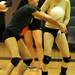 Huron's Kristen Vyletel, right, watches as teammate Kelsey Aaronson bumps the ball during the volleyball game against Skyline at Ann Arbor Huron High School on Oct. 4, 2011. Angela J. Cesere | AnnArbor.com