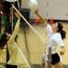 Huron's Gabriela Jaquery, left, jumps up to block a spike by Skyline's Maggie Halloran during the volleyball game at Ann Arbor Huron High School on Oct. 4, 2011. Angela J. Cesere | AnnArbor.com