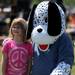 5-year-old Dexter resident Katie Halsey poses for a photo with the Karnik Foundation mascot during the Walk and Wag fundraiser for the Humane Society of Huron Valley at Rolling Hills Park on Saturday morning. Angela J. Cesere | AnnArbor.com