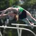 9-year-old Orchard Hills Athletic Club diver Annie Costello jumps into the air during her dive. Angela J. Cesere | AnnArbor.com 