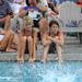 Chippewa Country Club divers Emily Tremewan, age 10, center right, and Jada Allen, age 11, center left, watch other divers jump into the pool. Angela J. Cesere | AnnArbor.com 