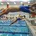 8-year-old Huron Valley Swim Club member Finnegan Klein jumps off his block to compete in heat 4 of the boys 8 and under 25 yard breaststroke race. Angela J. Cesere | AnnArbor.com 