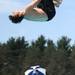 14-year-old Georgetown diving team member Ben Packard flips through the air competing in the 13 and 14-year-old boys diving championships. Angela J. Cesere | AnnArbor.com 