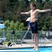 14-year-old Saline Sting Rays diver Kyle Wagner prepares to launch himself off the diving board. Angela J. Cesere | AnnArbor.com 