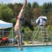 13-year-old Travis Pointe dive team member Dakota Hurbis straightens as he prepares to enter the water during his dive. Angela J. Cesere | AnnArbor.com 