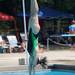 14-year-old Florie Holowicki of the Ochard Hills Swim Club enters the pool during her dive. Angela J. Cesere | AnnArbor.com 