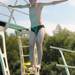 13-year-old Chelsea Aquatic Club member Ben Ingall jumps on the springboard to dive. Angela J. Cesere | AnnArbor.com 