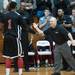 Milan's head coach Josh Tropea high fives C.J. Turnage as they are seconds away from winning the district final game over Temperance Bedford.
Courtney Sacco I AnnArbor.com 