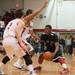 Milan's C.J. Turnage looks for an opening as he is guarded by Temperance Bedford's Ethan Babkiewiz during the first half of the district final game at Temperance Bedford high school Friday Mar. 8th.
Courtney Sacco I AnnArbor.com  