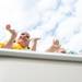 Kids wave as they ride down Ann Arbor Street during the Dexter Daze Parade Saturday, August, 10.
Courtney Sacco I AnnArbor.com  