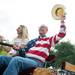 A man in a horse-drawn wagon waves as he rides down Ann Arbor Street during The Dexter Daze Parade Saturday, August, 10.
Courtney Sacco I AnnArbor.com  