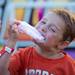 Aaron Fleming, age six, bites into some cotton candy at the Chelsea Community Fair in Chelsea, Friday, August, 23.
Courtney Sacco I AnnArbor.com