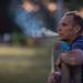 A man smokes a cigarette as he watches the tractor pull at the Chelsea Community Fair in Chelsea, Friday, August, 23.
Courtney Sacco I AnnArbor.com  